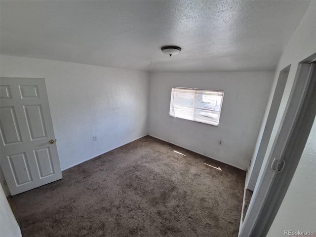 1266 Del Mar Pkwy, Aurora, CO 80010 - spare room featuring carpet floors and a textured ceiling