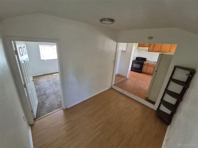 1266 Del Mar Pkwy, Aurora, CO 80010 - hall featuring lofted ceiling, light wood-style flooring, and baseboards