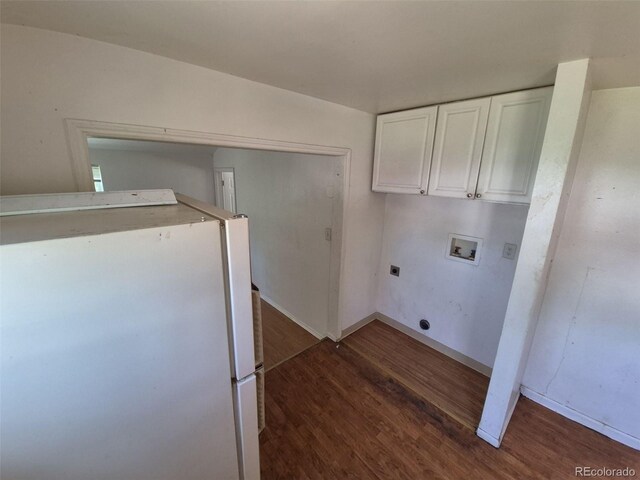 1266 Del Mar Pkwy, Aurora, CO 80010 - laundry area featuring washer hookup, electric dryer hookup, cabinet space, wood finished floors, and baseboards