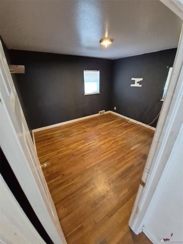 1266 Del Mar Pkwy, Aurora, CO 80010 - empty room with wood finished floors and baseboards