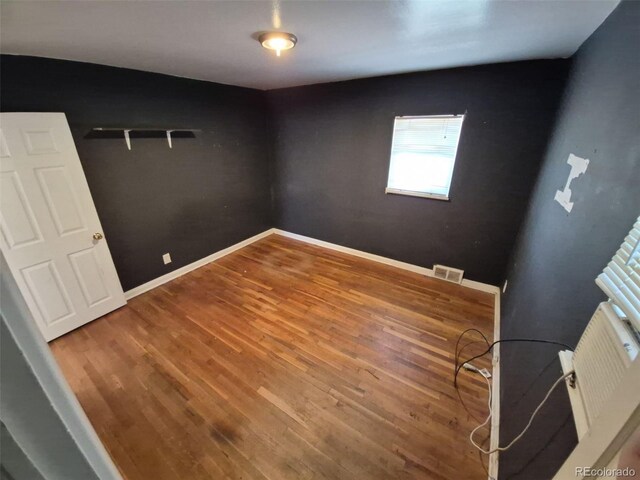 1266 Del Mar Pkwy, Aurora, CO 80010 - unfurnished bedroom featuring wood finished floors and baseboards