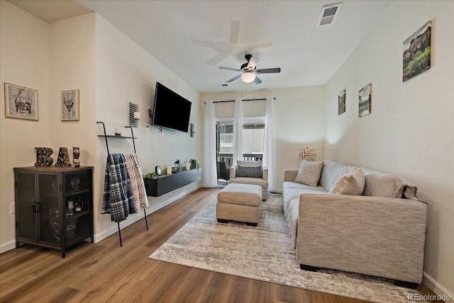 1841 S Dunkirk St Unit 207, Aurora, CO 80017 - living area with wood finished floors and a ceiling fan