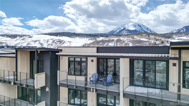 snow covered building with a mountain view