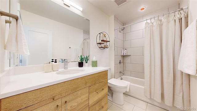 bathroom featuring visible vents, toilet, shower / tub combo with curtain, tile patterned floors, and vanity