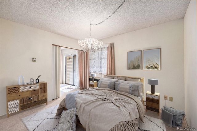 bedroom featuring a notable chandelier, light colored carpet, access to exterior, and a textured ceiling