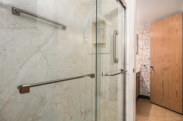 bathroom with parquet flooring and walk in shower