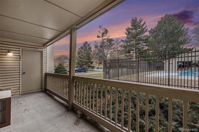 view of balcony at dusk