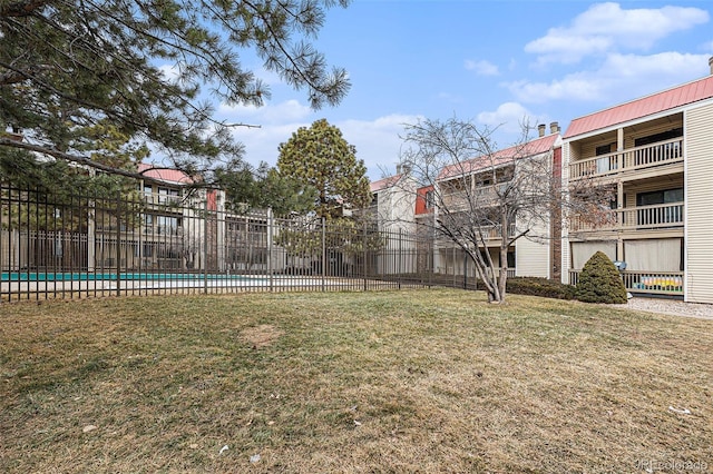 view of yard with a community pool