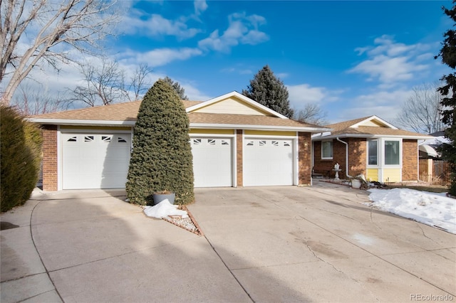 ranch-style house featuring a garage