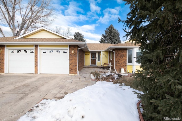 single story home featuring a garage