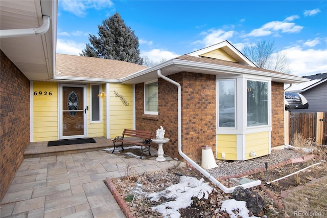 doorway to property with a patio