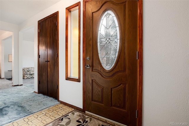 view of carpeted foyer