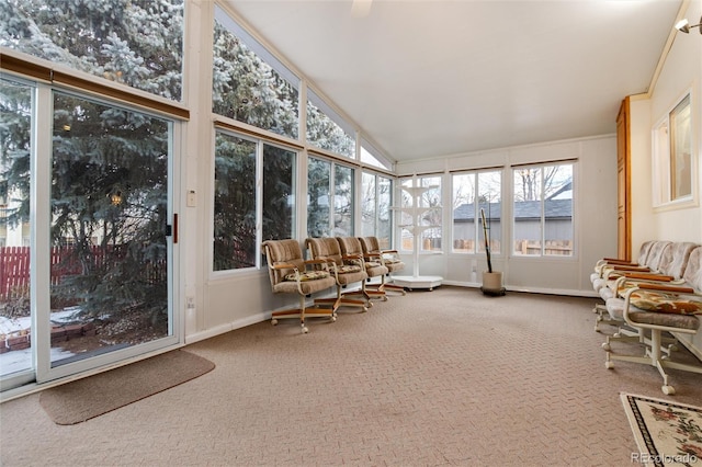 sunroom featuring vaulted ceiling