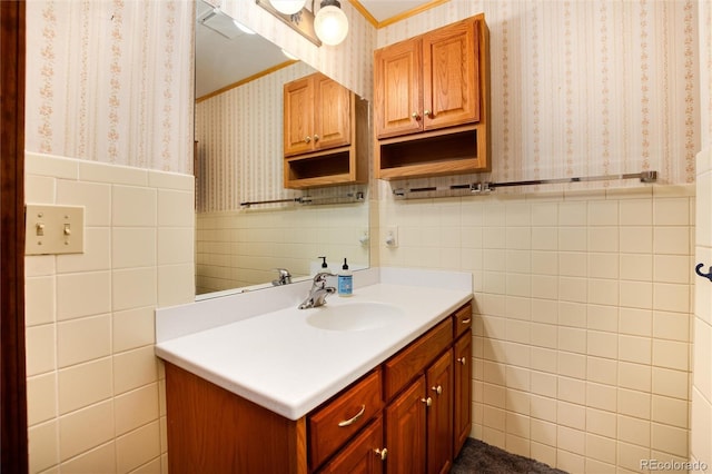 bathroom with vanity and tile walls