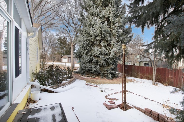 view of yard covered in snow