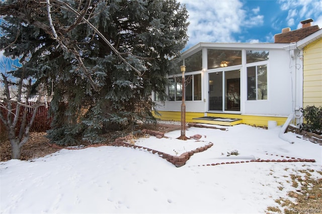 exterior space featuring a sunroom