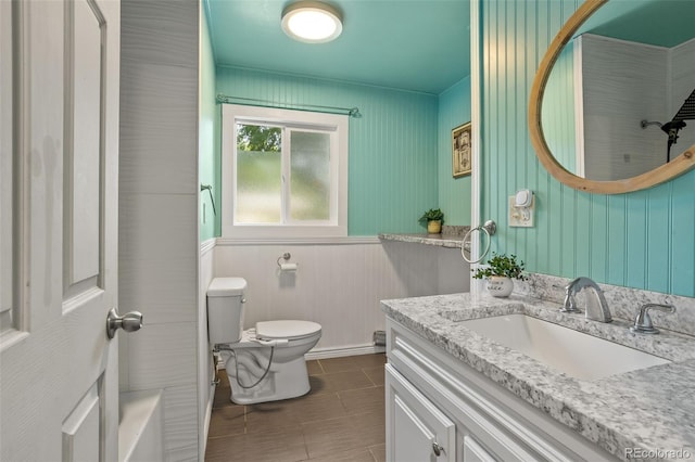 full bathroom with vanity, tile patterned floors, and toilet