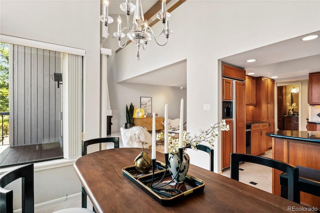 tiled dining area with a notable chandelier and beam ceiling