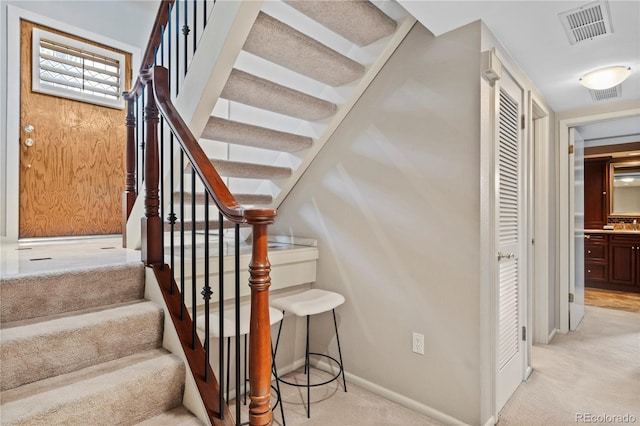 staircase with carpet flooring