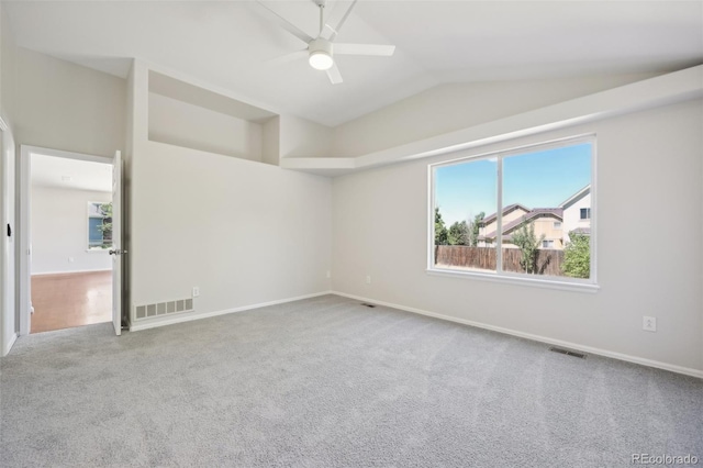 unfurnished room featuring carpet, ceiling fan, and lofted ceiling