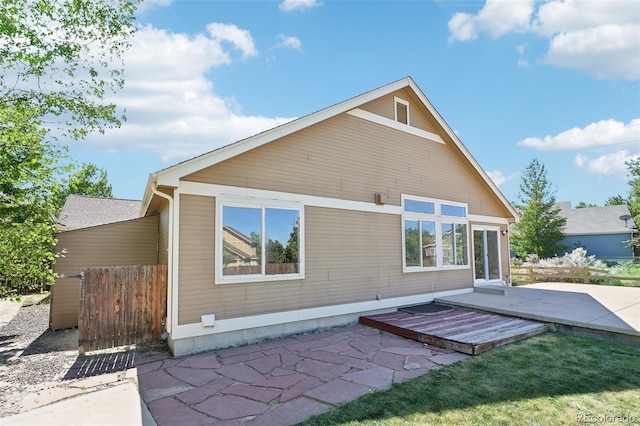 rear view of property featuring a patio area