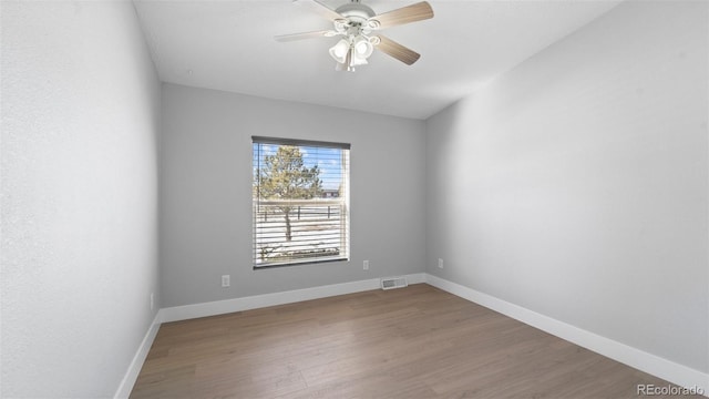 unfurnished room featuring ceiling fan and hardwood / wood-style floors