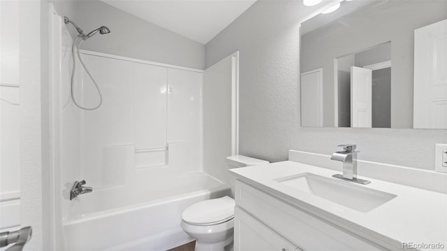 full bathroom with vanity, shower / bathing tub combination, vaulted ceiling, and toilet