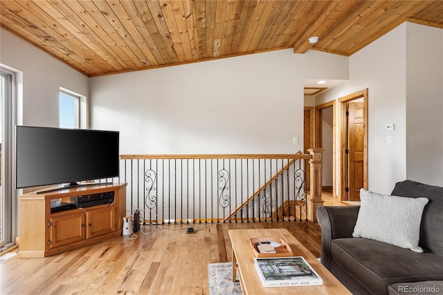 6773 Snowshoe Trl, Evergreen, CO 80439 - living area with light wood finished floors, wood ceiling, and crown molding