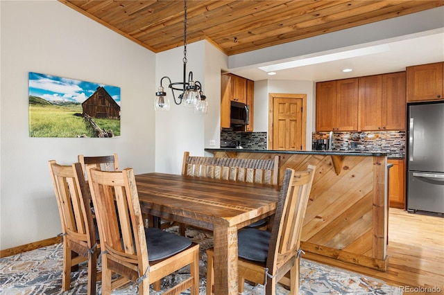 6773 Snowshoe Trl, Evergreen, CO 80439 - dining room with wood ceiling, a chandelier, and recessed lighting