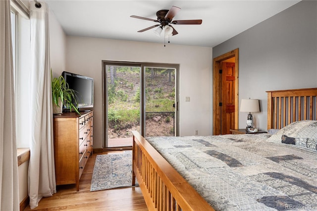 6773 Snowshoe Trl, Evergreen, CO 80439 - bedroom featuring access to outside, light wood-style floors, and ceiling fan