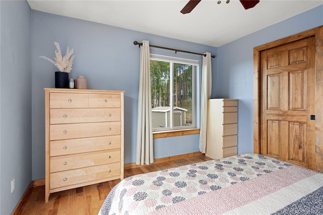 6773 Snowshoe Trl, Evergreen, CO 80439 - bedroom featuring wood finished floors and ceiling fan