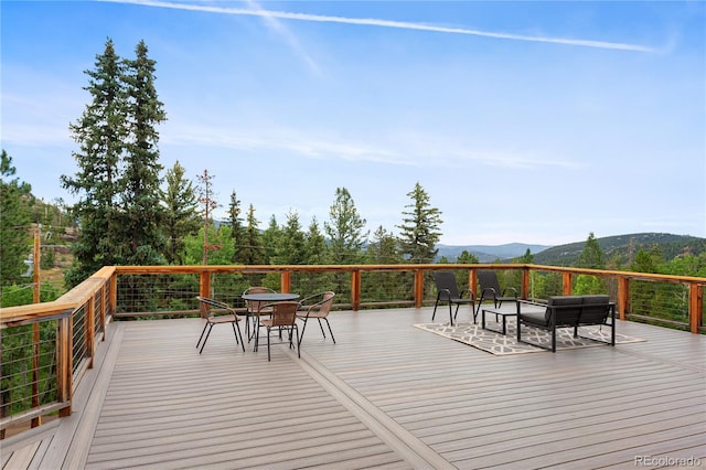 6773 Snowshoe Trl, Evergreen, CO 80439 - wooden deck featuring a mountain view