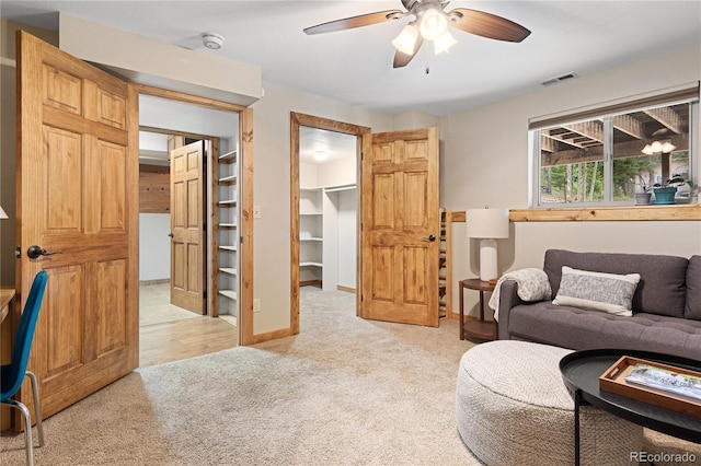 6773 Snowshoe Trl, Evergreen, CO 80439 - living area featuring light carpet and ceiling fan