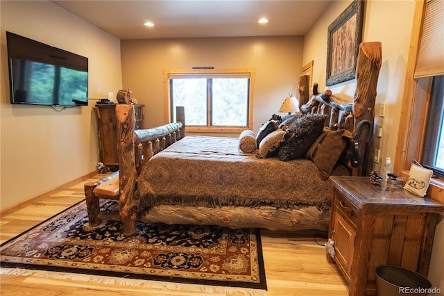 bedroom with light hardwood / wood-style flooring