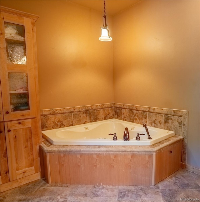 bathroom with tiled bath