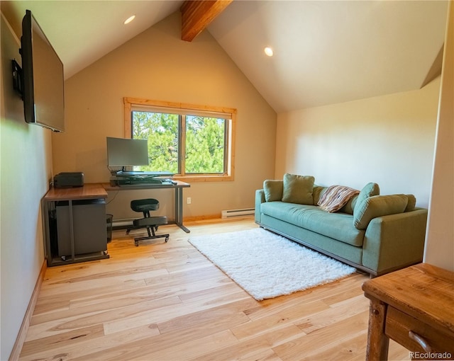 office space with lofted ceiling with beams, a baseboard radiator, and light wood-type flooring