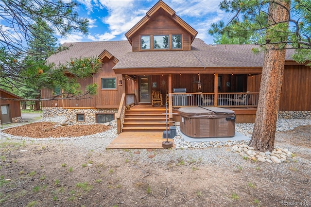 cabin featuring a hot tub