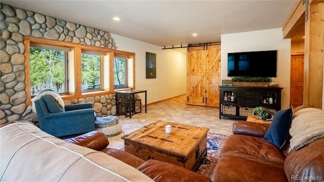 living room featuring a barn door