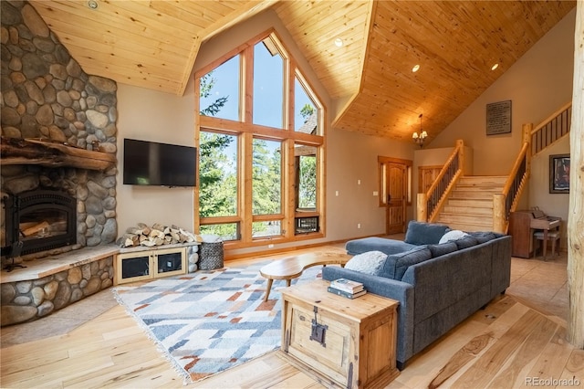 living room with high vaulted ceiling, a fireplace, stairs, wood-type flooring, and wooden ceiling