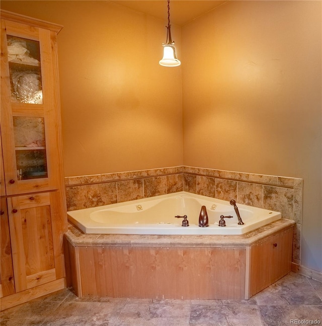 full bathroom featuring a whirlpool tub