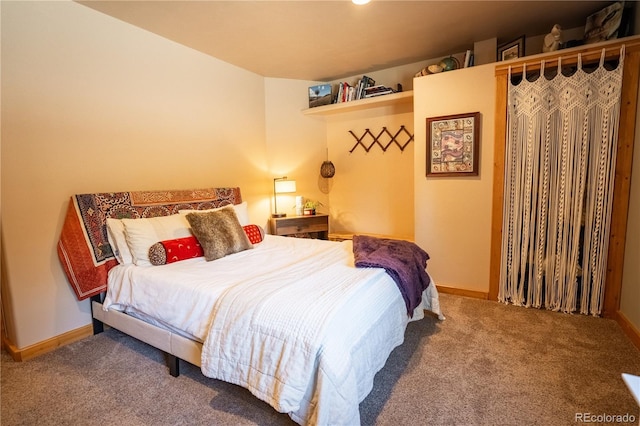carpeted bedroom with baseboards