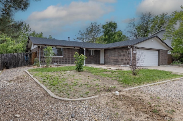 7042 W 76th Ave, Arvada, CO 80003 - ranch-style house featuring brick siding, an attached garage, concrete driveway, and roof with shingles