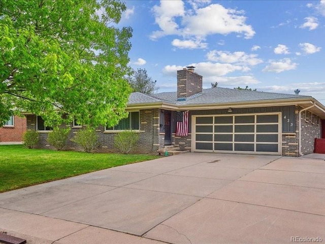 423 Empire St, Aurora, CO 80010 - view of front facade with concrete driveway, brick siding, an attached garage, a front lawn, and a chimney