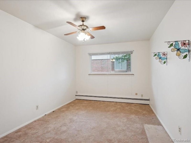 423 Empire St, Aurora, CO 80010 - carpeted empty room with baseboard heating, ceiling fan, and baseboards