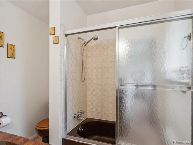 423 Empire St, Aurora, CO 80010 - bathroom featuring toilet and enclosed tub / shower combo