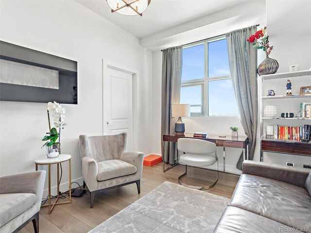 2001 Lincoln St Unit 1822, Denver, CO 80202 - living area featuring baseboards and wood finished floors