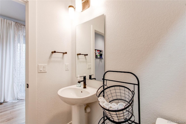 bathroom with hardwood / wood-style flooring