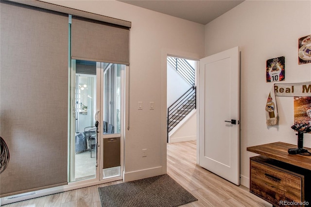 doorway to outside featuring light wood-type flooring