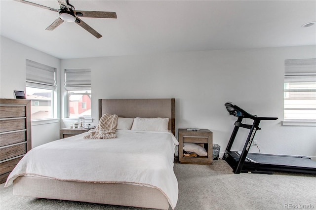 carpeted bedroom featuring ceiling fan