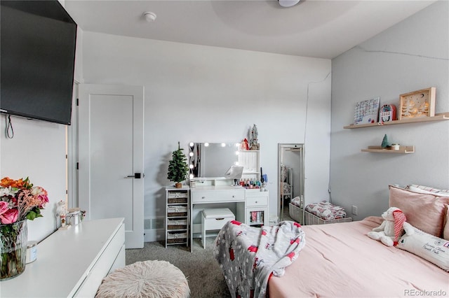 bedroom featuring dark carpet